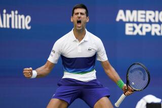 Novak Djokovic, of Serbia, reacts after scoring a point against Kei Nishikori, of Japan, during the third round of the US Open tennis championships, Saturday, Sept. 4, 2021, in New York. (AP Photo/John Minchillo)