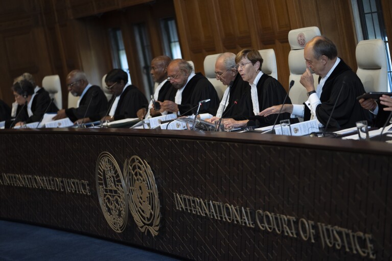 Presiding judge Joan Donoghue, second right, opens the World Court session where Ukraine's legal battle against Russia over allegations of genocide used by Moscow to justify its 2022 invasion, resumed in The Hague, Netherlands, Monday, Sept. 18, 2023.  (AP Photo/Peter Dejong, File)