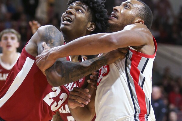 Alabama's Nick Pringle and Ohio State's Zed Key look for a rebound during the first half of an NCAA college basketball game Friday, Nov. 24, 2023, in Niceville, Fla. (AP Photo/Michael Snyder)