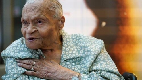 Tulsa Race Massacre survivor Viola Ford Fletcher gestures while speaking during an interview with The Associated Press, Friday, June 16, 2023, in New York. At age 109, Fletcher is releasing a memoir about the life she lived in the shadow of the massacre after a white mob laid waste to the once-thriving Black enclave known as Greenwood. “Don't Let Them Bury My Story” is published Tuesday, July 4, and becomes widely available for purchase on Aug. 15. (AP Photo/Mary Altaffer)