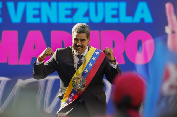 Venezuelan President Nicolas Maduro addresses government supporters on his inauguration day at Miraflores presidential palace in Caracas, Venezuela, Jan. 10, 2025. (AP Photo/Matias Delacroix)
