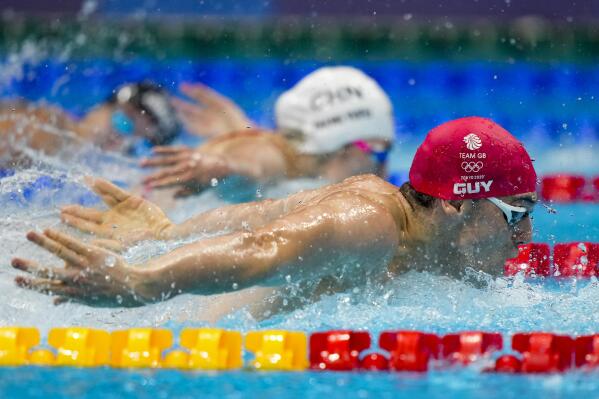 James Guy, of Britain, swims in a mixed 4x100-meter medley relay at the 2020 Summer Olympics, Saturday, July 31, 2021, in Tokyo, Japan. Britain won the gold medal. (AP Photo/David Goldman)