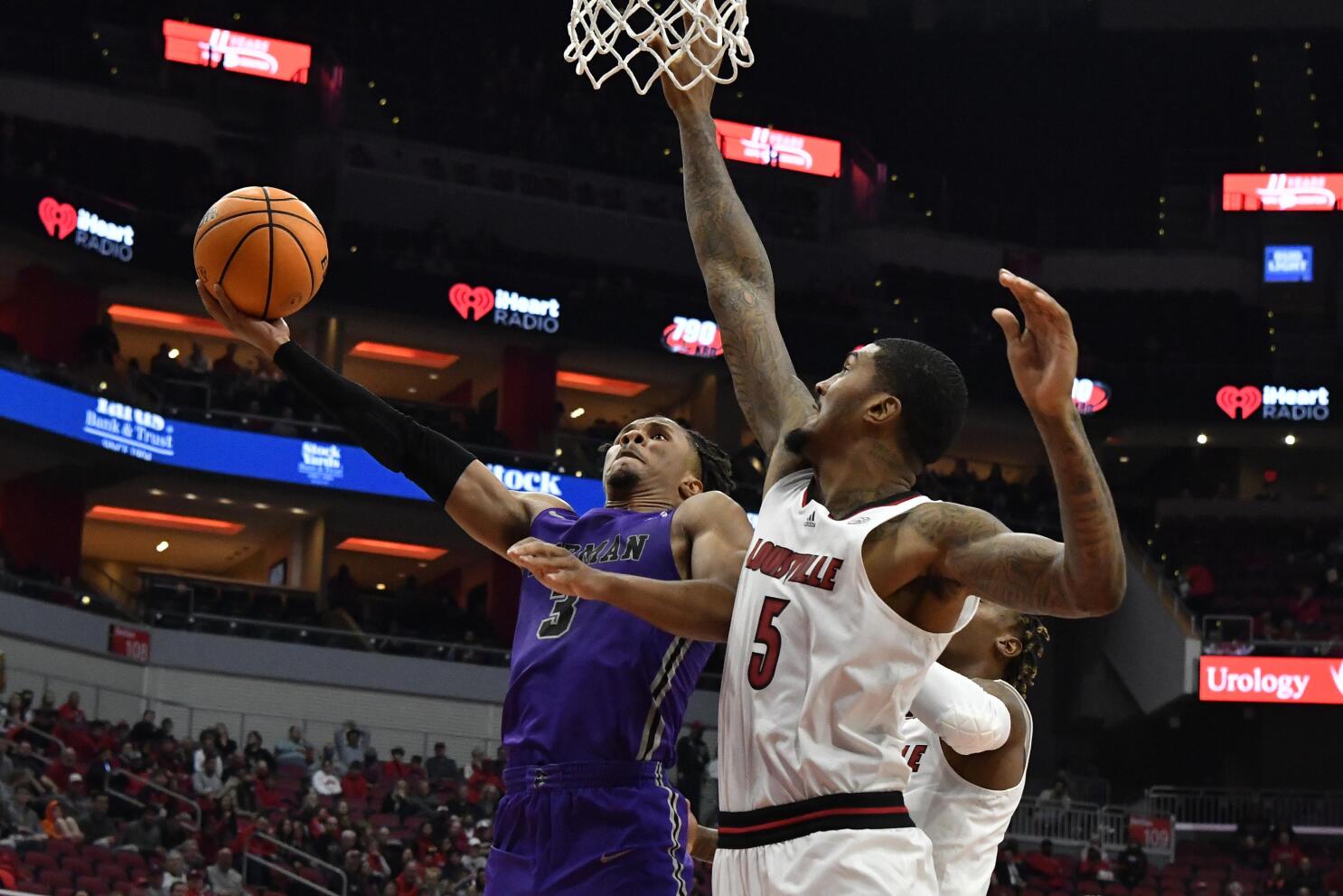 Mason Faulkner of the Louisville Cardinals brings the ball up court News  Photo - Getty Images