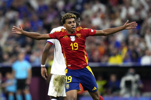 FILE - Spain's Lamine Yamal reacts during a semifinal match between Spain and France at the Euro 2024 soccer tournament in Munich, Germany, July 9, 2024. (AP Photo/Hassan Ammar, File)