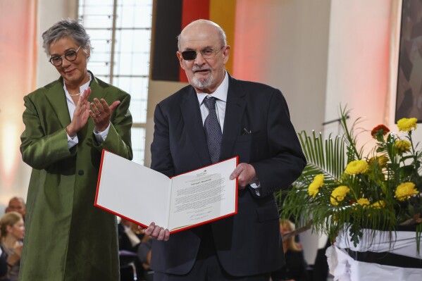 Author Salman Rushdie receives the Peace Prize of the German book trade (Friedenspreis des Deutschen Buchhandels) during a ceremony at the Church of St. Paul in Frankfurt, Germany, Sunday, Oct. 22, 2023. Rushdie called for the unconditional defense of freedom of expression as he received a prestigious German prize that recognizes his literary work and his resolve in the face of constant danger. (Kai Pfaffenbach/Pool Photo via AP)