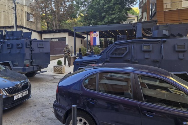 Kosovo police officers search restaurant and building in northern Serb-dominated part of ethnically divided town of Mitrovica, Kosovo, Friday, Sept. 29, 2023. In one of the worst confrontations since Kosovo declared independence from Serbia in 2008, about 30 masked men opened fire on a police patrol near the village of Banjska early Sunday. One Kosovo police officer and three gunmen were killed in Sunday's shootout between Serb insurgents and Kosovo police. (AP Photo/Radul Radovanovic)