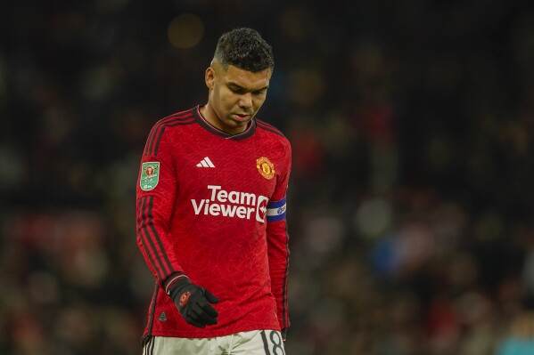 Manchester United's Casemiro leaves the pitch after the first half during the EFL Cup fourth round soccer match between Manchester United and Newcastle at Old Trafford stadium in Manchester, England, Wednesday, Nov. 1, 2023. (AP Photo/Dave Thompson)