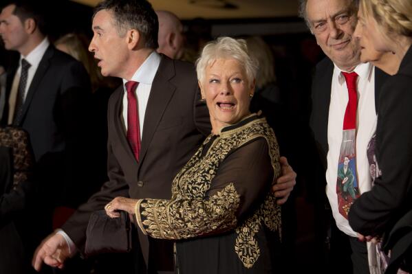 British actors Steve Coogan, left, and Judi Dench, second from left, arrive with British director Stephen Frears, second from right, for the screening of Philomena, as part of the 57th BFI London Film Festival, at a central London cinema, Wednesday, Oct. 16, 2013. (Photo by Joel Ryan/Invision/AP)