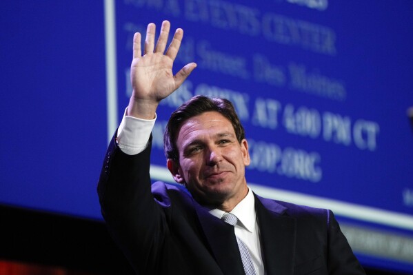FILE - Republican presidential candidate Florida Gov. Ron DeSantis waves at the Republican Party of Iowa's 2023 Lincoln Dinner in Des Moines, Iowa, July 28, 2023. (AP Photo/Charlie Neibergall, File)