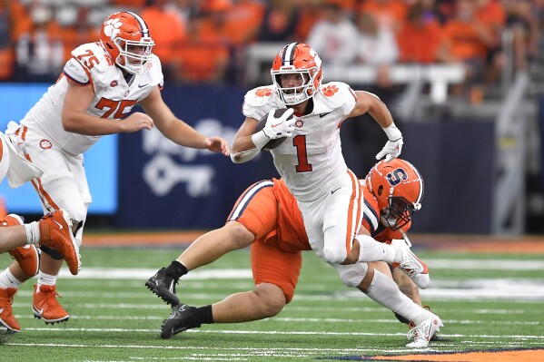 Clemson running back Will Shipley (1) runs with the ball during the second half of an NCAA college football game against Syracuse in Syracuse, N.Y., Saturday, Sept. 30, 2023. (AP Photo/Adrian Kraus)