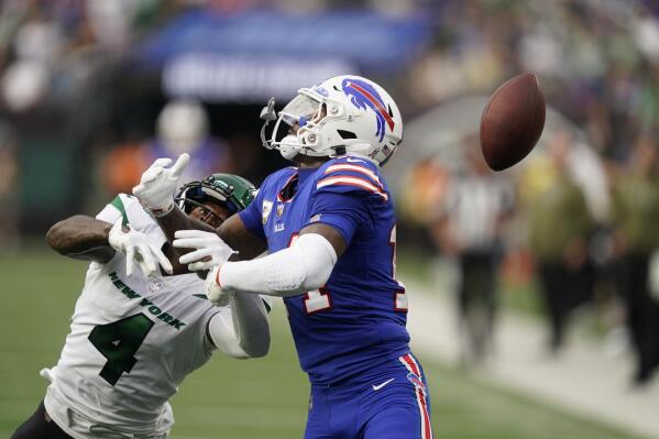 New York Jets' D.J. Reed (4) breaks up a pass to Buffalo Bills' Stefon Diggs, right, during the second half of an NFL football game, Sunday, Nov. 6, 2022, in East Rutherford, N.J. The Jets won 20-17. (AP Photo/John Minchillo)