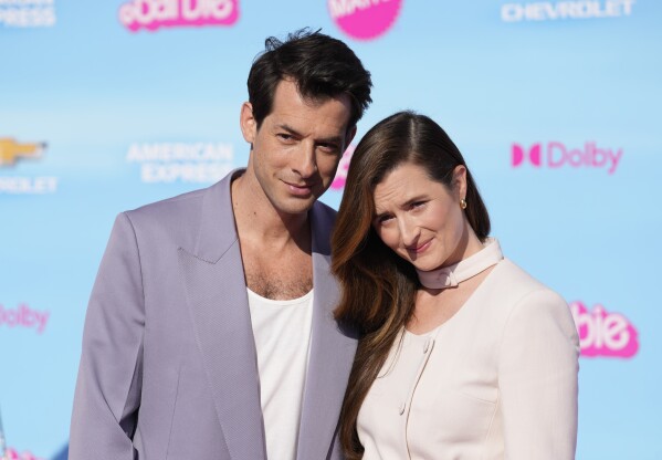 Mark Ronson, left, and Grace Gummer arrive at the premiere of "Barbie" on Sunday, July 9, 2023, at The Shrine Auditorium in Los Angeles. (AP Photo/Chris Pizzello)