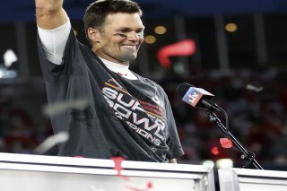 Tampa Bay Buccaneers quarterback Tom Brady (12) holds the Vince Lombardi trophy following the NFL Super Bowl 55 football game against the Kansas City Chiefs, Sunday, Feb. 7, 2021 in Tampa, Fla. Tampa Bay won 31-9. (Ben Liebenberg via AP)