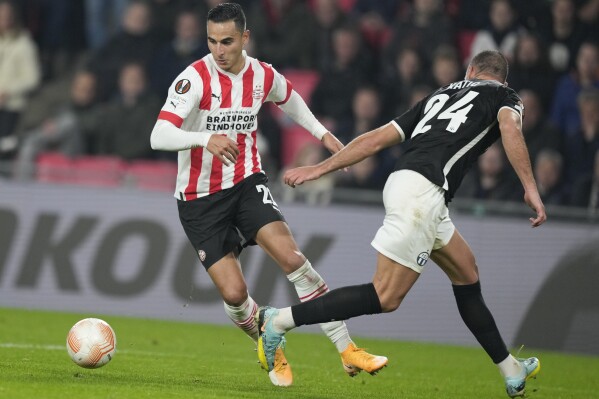 FILE - Then-PSV's and currently Bundesliga's Mainz player Anwar El Ghazi, left, scores his side's fifth goal during the Europa League group A soccer match between PSV and Zurich at the Philips stadium in Eindhoven, Netherlands, Thursday, Oct. 13, 2022. Bundesliga club Mainz has suspended Dutch forward Anwar El Ghazi for what it says was an “unacceptable” social media post about the latest Israel-Hamas war. (AP Photo/Peter Dejong, File)