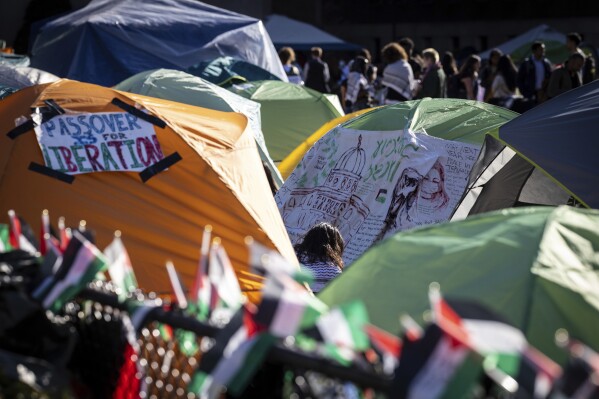 Signs are displayed in tents at the pro-Palestinian demonstration camp at Columbia University in New York on Wednesday, April 24, 2024. (AP Photo/Stefan Jeremiah)