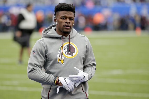 FILE - In this Oct. 28, 2018, file photo, then-Washington Redskins running back Chris Thompson (25) warms up before an NFL football game against the New York Giants in East Rutherford, N.J. Reporters from The Associated Press spoke to more than two dozen athletes from around the globe -- representing seven countries and 11 sports -- to get a sense of how concerned or confident they are about resuming competition. Thompson is an NFL running back. He’s also the father of a 4-month-old daughter, Kali.  “If I go practice or play and I come back home with the virus, she’s not strong enough yet to fight something like that. For me, that’s my biggest worry,” said Thompson, who signed with the Jacksonville Jaguars this month after seven seasons with the Redskins. (AP Photo/Seth Wenig, File)