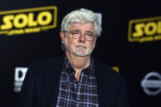 FILE - George Lucas arrives at the premiere of "Solo: A Star Wars Story" at El Capitan Theatre on Thursday, May 10, 2018, in Los Angeles. Lucas will receive an honorary Palme d'Or at the Cannes Film Festival next month, festival organizers announced Tuesday, April 9, 2024. He will be honored at the closing ceremony to the 77th Cannes Film Festival on May 25. (Photo by Jordan Strauss/Invision/AP, File)