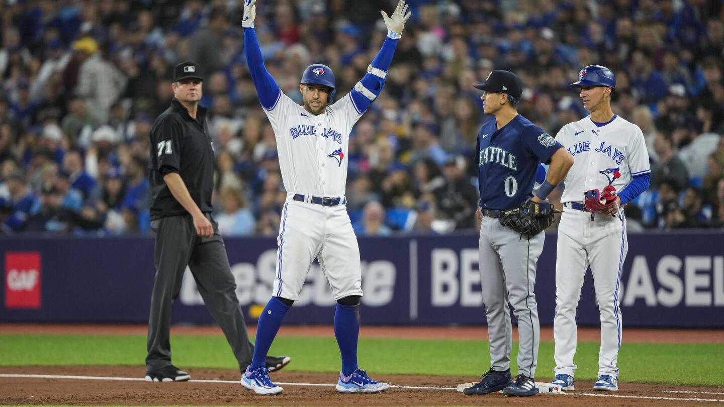 Seattle Mariners' Cal Raleigh, second from left, celebrates with starting  pitcher Logan Gilbert, left, right fielder Teoscar Hernandez, third from  left, and Julio Rodriguez, right, after Raleigh hit a walk-off single during