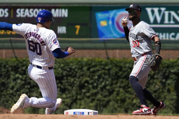 Ian Happ and Michael Busch homers power Cubs past Twins 8-2 | AP News