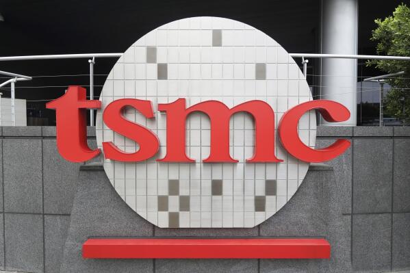 Taiwan Semiconductor Manufacturing Co., Ltd. (TSMC) logo brands the headquarters in Hsinchu, Taiwan, Wednesday, Oct. 20, 2021. TSMC, the biggest contract manufacturer of processor chips for smartphones and other products, said Thursday, Jan. 12, 2023, its quarterly profit rose 78% over a year earlier but forecast weak demand this year. (AP Photo/Chiang Ying-ying)