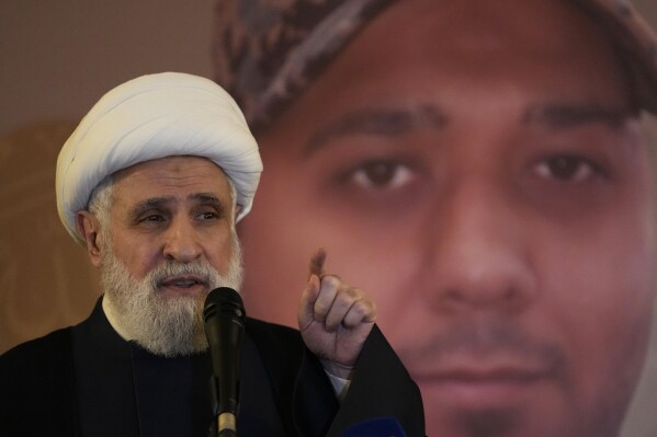 Sheik Naim Kassem, Hezbollah's deputy leader speaks during a memorial of a Hezbollah fighter who killed few days ago in South Lebanon by an Israeli airstrike, in Beirut, Lebanon, Thursday, Dec. 28, 2023. Israeli officials are stepping up threats against Hezbollah, the Lebanese militant group, warning that Israel is running out of patience as the two sides continue to trade fire along Israel's volatile northern border. (AP Photo/Hussein Malla)