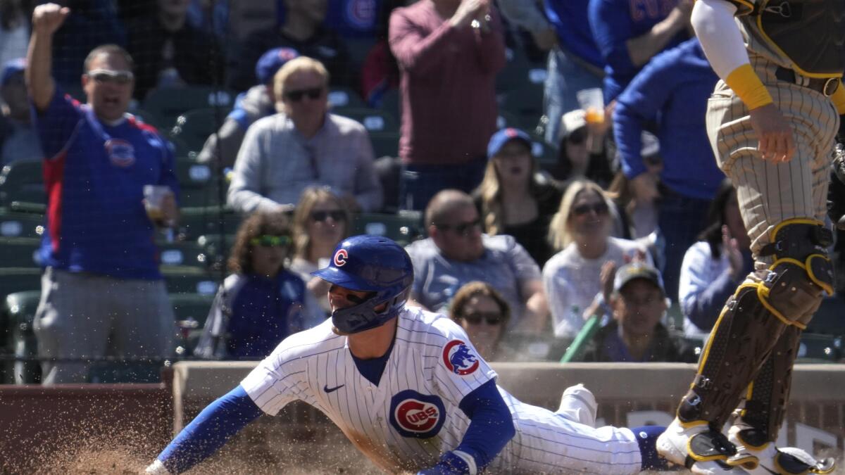 Chicago Cubs catcher Tucker Barnhart, left, celebrates with center fielder  Nelson Velazquez after the Cubs defeated the San Diego Padres 5-2 in a  baseball game in Chicago, Thursday, April 27, 2023. (AP