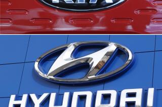 FILE- This combination of file photos shows the logo of Kia Motors, top and Hyundai logo, bottom.   Hyundai and Kia are recalling more than 550,000 cars and minivans in the U.S., Thursday, Sept. 30, 2021,  because the turn signals can flash in the opposite direction of what the driver intended. The recall covers Hyundai’s Sonata midsize car from the 2015 through 2015 model years, and Sonata gas-electric hybrids from 2016 and 2017. Kia’s Sedona minivan from 2015 through 2017 also is affected.  (AP Photo, File)