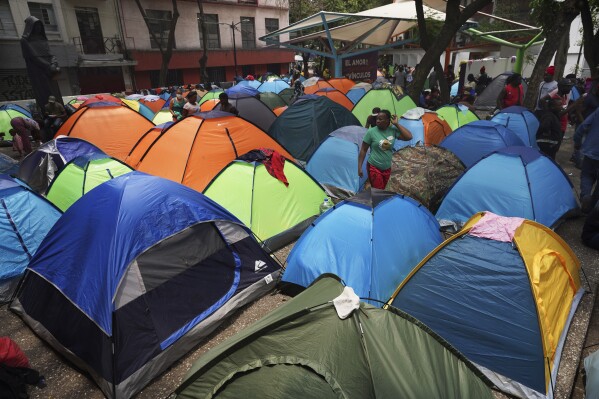 FILE - Haitian migrants camp out at Giordano Bruno plaza in the Juarez neighborhood of Mexico City, May 18, 2023. Federal immigration authorities said Thursday, June 6, 2024, they cleared the tent encampment, one of the largest in the city's downtown. (AP Photo/Marco Ugarte, File)