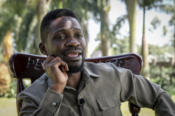 FILE - Ugandan opposition figure Bobi Wine, whose real name is Kyagulanyi Ssentamu, speaks to The Associated Press at his home in Magere, just north of the capital Kampala, in Uganda, Tuesday, Oct. 4, 2022. Ugandan security forces on Thursday, Oct. 5, 2023, briefly detained opposition figure Bobi Wine and foiled a planned street demonstration by his supporters who intended to welcome him at the airport. (AP Photo/Hajarah Nalwadda, File)