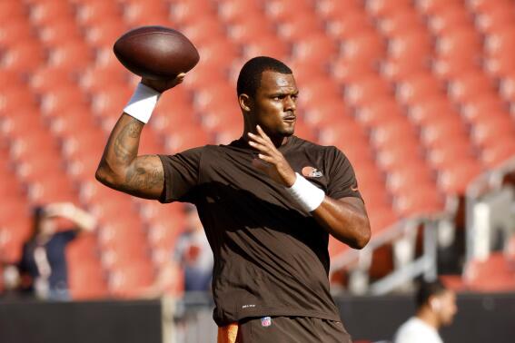FILE - Cleveland Browns quarterback Deshaun Watson (4) warms up prior to an NFL preseason football game against the Chicago Bears, Saturday Aug. 27, 2022, in Cleveland. Deshaun Watson returned to the Browns' training facility Monday, Oct. 10, 2022, the quarterback's next step in his potential return from an NFL suspension. Watson, banned for 11 games for alleged sexual misconduct after being accused by women in Texas of lewd actions during massage therapy sessions, has been away from the Browns since Aug. 30.(AP Photo/Kirk Irwin, File)