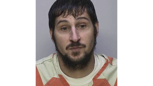 This booking photo provided by the Warren, Pa., City Police Department shows Michael Burham. Authorities searching for the inmate described by police as “very dangerous” who used bed sheets to escape from a northwestern Pennsylvania jail on Thursday, July 6, 2023, say they believe he is still in the area and have found stockpiles or campsites in the woods he may have been using. Burham was a suspect in a homicide investigation and was being held on $1 million bail on kidnapping, burglary and other charges, authorities said. (Warren City Police Department via AP)