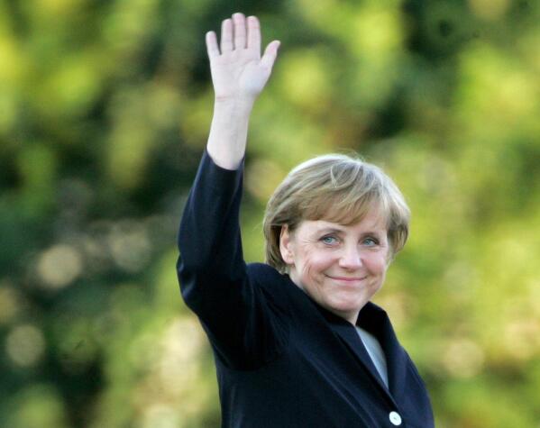 FILE - Angela Merkel arrives for a television debate with Chancellor Gerhard Schroeder at a television studio in Berlin, Sept. 4, 2005. As chancellor, Merkel has been credited with raising Germany’s profile and influence, helping hold a fractious European Union together, managing a string of crises and being a role model for women in a near-record tenure that ends with her leaving office amid praise from abroad and enduring popularity at home. Her designated successor Olaf Scholz is expected to take office Wednesday, Dec. 8, 2021. (AP Photo/Jockel Finck, File)