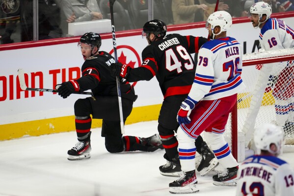 Ottawa Senators left wing Brady Tkachuk, left, celebrates a goal on New York Rangers goaltender Igor Shesterkin (31) during the second period of an NHL hockey game Tuesday, Dec. 5, 2023, in Ottawa, Ontario. (Sean Kilpatrick/The Canadian Press via 鶹ýapp)