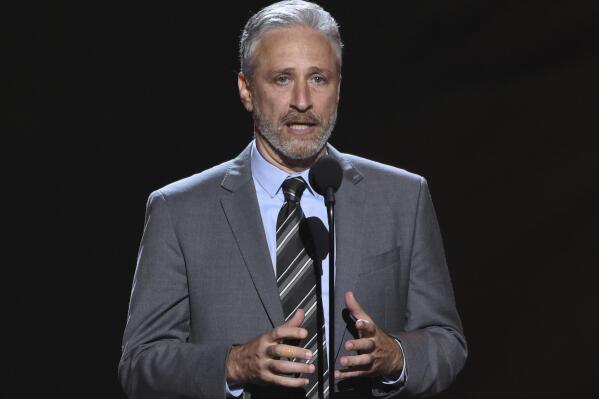 FILE- Jon Stewart presents the Pat Tillman award for service on July 18, 2018, at the ESPY Awards in Los Angeles. Stewart has been named the 23rd recipient of the Kennedy Center's Mark Twain Award for lifetime achievement in comedy.  (Photo by Phil McCarten/Invision/AP, File)