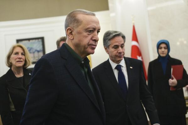 Turkish President Recep Tayyip Erdogan, left, talks to U.S. Secretary of State Antony Blinken during their meeting at Esenboga airport in Ankara, Turkey, Monday, Feb. 20, 2023. (AP Photo/Burhan Ozbilici, Pool)