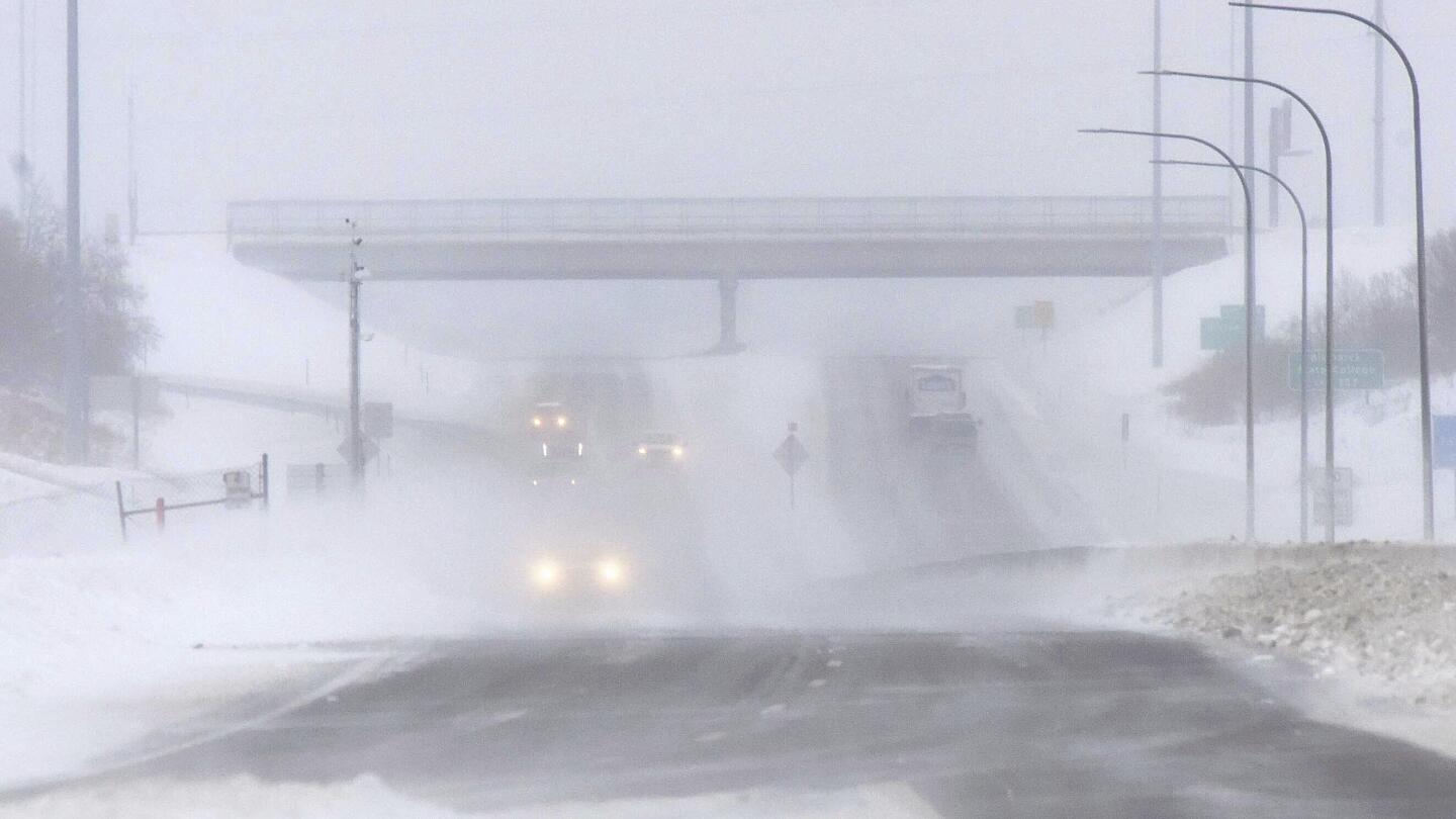 South cleans up from tornadoes as blizzards advance north