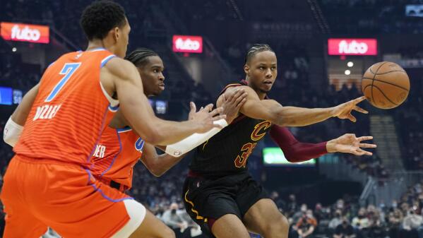 Cleveland Cavaliers' Evan Mobley (4) drives against Oklahoma City Thunder's Darius  Bazley (7) in the first half of an NBA basketball game, Saturday, Jan. 22,  2022, in Cleveland. (AP Photo/Tony Dejak Stock Photo - Alamy