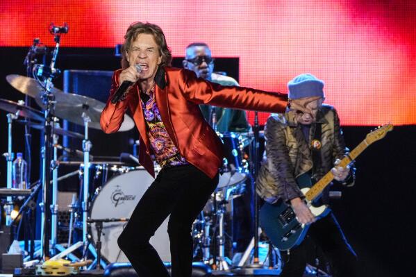 FILE - Mick Jagger, center, and Keith Richards, right, of the band the Rolling Stones, perform during their Sixty Stones Europe 2022 tour in Madrid, Spain on June 1, 2022. The Rolling Stones will celebrate their 60th anniversary with an upcoming four-part docuseries on EPIX that takes turns focusing on band’s most iconic members, with in-depth portraits of singer Jagger, guitarists Richards and Ronnie Wood, and the late drummer Charlie Watts. “My Life as a Rolling Stone” will premiere on Aug. 7. (AP Photo/Manu Fernandez, File)