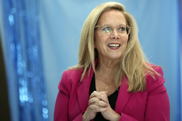 Laura Gillen, Democratic candidate for New York's 4th Congressional District, reacts before a roundtable discussion outlining her policy platform to lower healthcare costs for Latino families, Thursday, Oct. 24, 2024, in Freeport, N.Y. (AP Photo/Heather Khalifa)