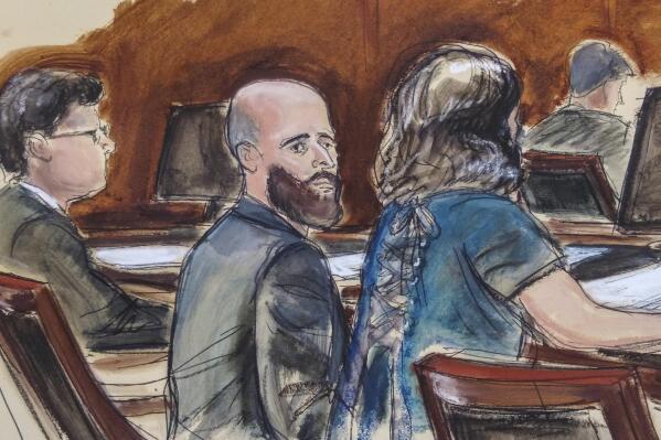FILE - In this courtroom sketch, Joshua Schulte, center, is seated at the defense table flanked by his attorneys during jury deliberations, Wednesday March 4, 2020, in New York. Schulte, the former CIA software engineer accused of causing the biggest theft of classified information in CIA history, has been convicted at a New York City retrial. A jury reached the guilty verdict against Joshua Schulte on Wednesday, July 13, 2022 in federal court in Manhattan. (Elizabeth Williams via AP)
