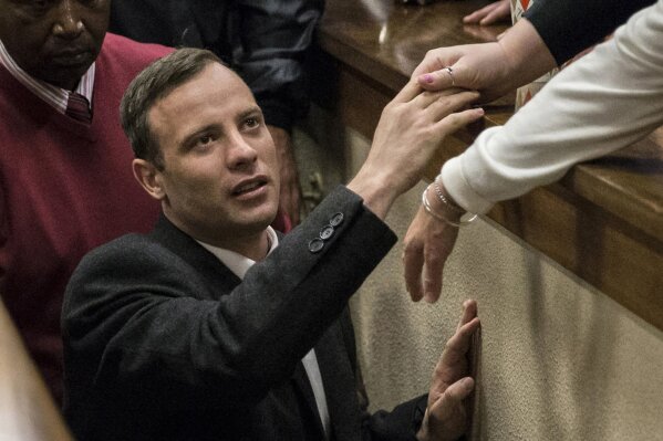 
              FILE - In this July 6, 2016, file photo, Oscar Pistorius leaves the High Court in Pretoria, South Africa, after a judge passed a new sentence of six years imprisonment after his conviction was changed to murder for shooting girlfriend Reeva Steenkamp in 2013. Pistorius has had his prison sentence extended to 13 years and 5 months in the High Court of Appeal in Bloemfontein Friday, Nov. 24, 2017. (AP Photo/Marco Longari, Pool Photo via AP, File)
            