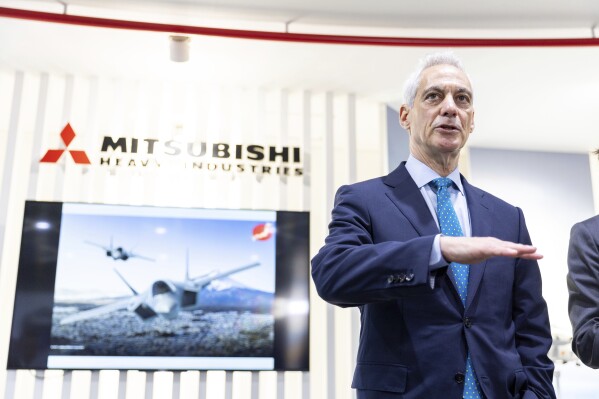In this photo provided by U.S. Embassy in Japan, U.S. Ambassador to Japan, Rahm Emanuel, speaks during his visit to Mitsubishi Heavy Industries’ F-35 fighter jet final assembly and inspection plant in Toyoyama, Aichi prefecture, western Japan, Tuesday, April 16, 2024. (U.S. Embassy via AP)