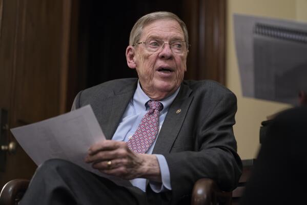 FILE - Sen. Johnny Isakson, R-Ga., meets with his staff in his office on Capitol Hill in Washington, Dec. 2, 2019. Isakson, an affable Georgia Republican politician who rose from the ranks of the state Legislature to become a U.S. senator, has died. He was 76. Georgia Gov. Brian Kemp’s office confirmed the death in a news release Sunday, Dec. 19, 2021. (AP Photo/J. Scott Applewhite, file)