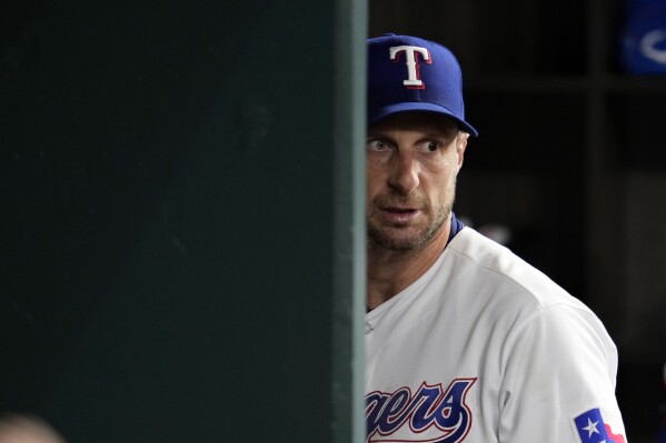 Texas Rangers' Jordan Montgomery walks to the dugout during a
