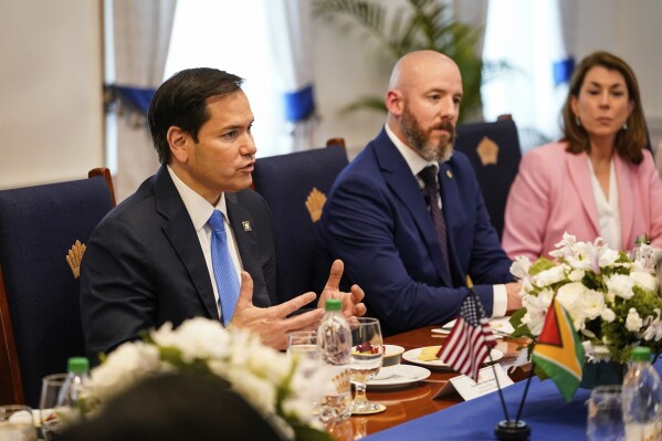 U.S. Secretary of State Marco Rubio, left, meets with Guyanese President Mohamed Irfaan Ali in Georgetown, Guyana, Thursday, March 27, 2025. (Nathan Howard/Pool photo via AP)