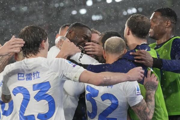 Inter Milan's Marcus Thuram, center, celebrates with his teammates after scoring against Roma during the Italian Serie A soccer match between Roma and Inter Milan at Rome's Olympic stadium, Saturday, Feb. 10, 2024. (APPhoto/Alessandra Tarantino)