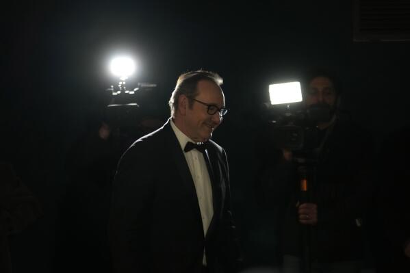 Actor Kevin Spacey smiles as he arrives at the Cinema Massimo in Turin, Italy, Monday, Jan. 16, 2023. Kevin Spacey was in the northern Italian city of Turin on Monday to receive the lifetime achievement award, teach a master class and introduce a screening of the 1999 film "American Beauty." (AP Photo/Luca Bruno)