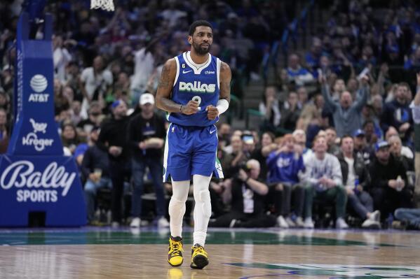 Dallas Mavericks guard Kyrie Irving (2) celebrates after sinking a basket in the second half of an NBA basketball game against the Minnesota Timberwolves, Monday, Feb. 13, 2023, in Dallas. (AP Photo/Tony Gutierrez)
