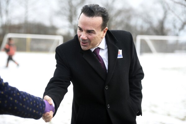 FILE - Bridgeport Mayor Joe Ganim greets supporters outside Central High School on the day of the redo primary election for mayor, Jan. 23, 2024, in Bridgeport, Conn. A do-over general election this Tuesday will mark the fourth time registered Democrats have voted for the city's next mayor, after the judge voided the initial primary over surveillance footage showing a supporter of incumbent Mayor Joe Ganim putting multiple absentee ballots into a drop box. For those counting, there have now been two primaries and one general election (which didn’t count). (Ned Gerard/Hearst Connecticut Media via AP, File)