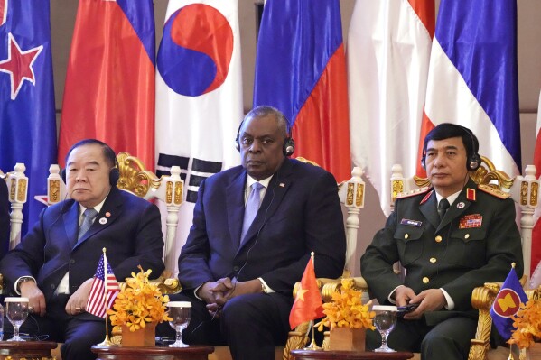 FILE - U.S. Secretary of Defense Lloyd Austin, center, Vietnam Minister of Defense Phan Van Giang, right, and Thai Deputy Prime Minister Prawit Wongsuwon, left, listen to a speech by Cambodian Prime Minister Hun Sen, during the 9th ASEAN Defense Ministers' Meeting Plus in Siem Reap, Cambodia, Wednesday, Nov. 23, 2022. U.S. Defense Secretary Lloyd Austin is scheduled to make an official visit to Cambodia, one of China's closest allies in Southeast Asia, after holding talks with his Chinese counterpart at an annual security conference in Singapore, officials said in a statement issued Friday, May 24, 2024. (AP Photo/Heng Sinith, File)